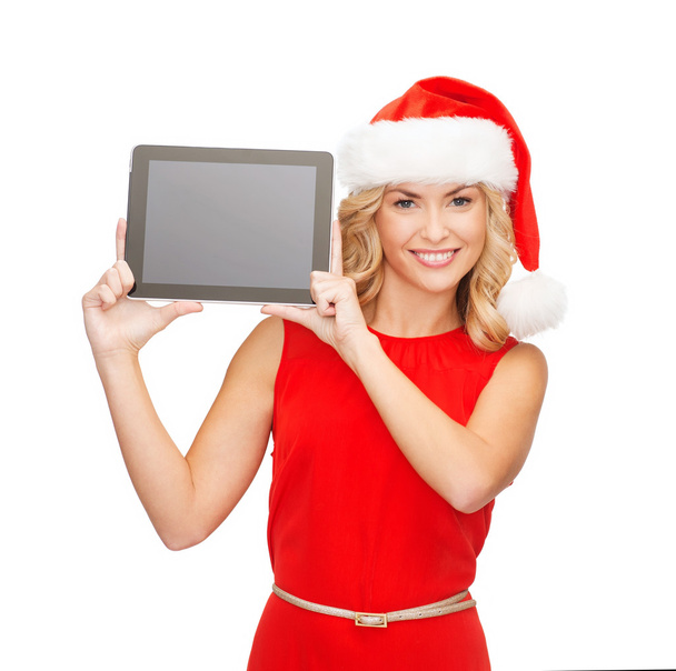 Woman in santa helper hat with tablet pc - Photo, image