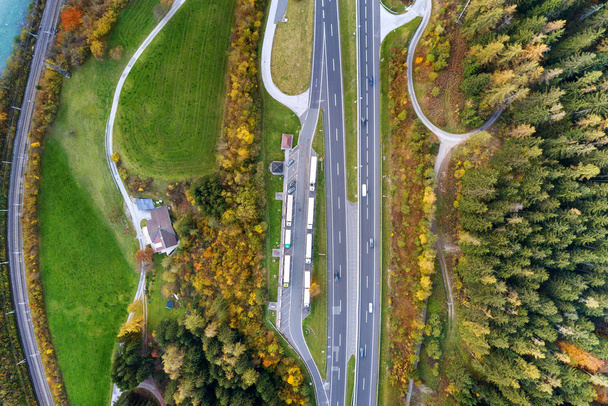 Top dawn aerial view of freeway speed road between yellow autumn - Photo, Image