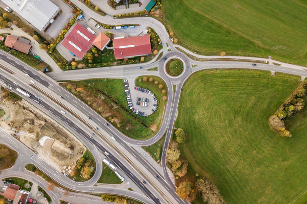 Top down aerial view of freeway interstate road with moving traf - 写真・画像