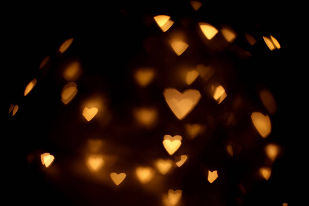 Overlay blurry background of golden hearts bokeh, for Valentine's or holidays card - Foto, Imagem