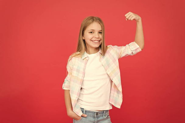 Girls power. Happy childhood. Girl cute child smiling face expression on red background. Positive emotions concept. Happy childrens day. Being happy every day. Schoolgirl casual style emotional kid - Photo, Image