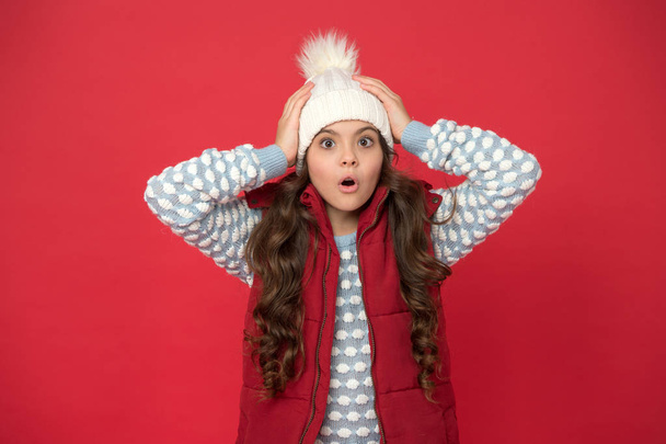 Oh no. surprised child in cosy knitted outfit. winter fashion for kids. childhood happiness. happy winter holiday and activity. weather forecast. feeling warm this winter. oh my god - Foto, immagini