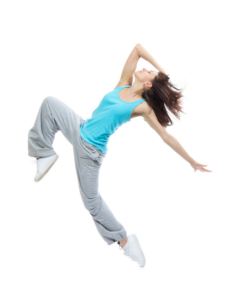 Modern teenage girl dancer jumping and dancing - Photo, Image