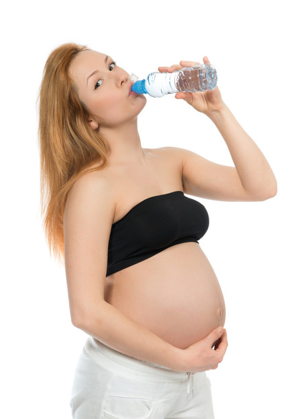 Young happy pregnant woman drinking water bottle - Foto, Imagem