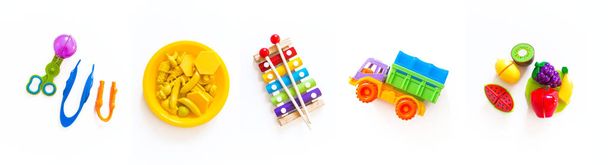 Toys for games with children. Horizontal Banner Bright rainbow. White background. - Foto, imagen