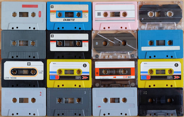 Collection of colorful old audio cassette tape on wooden backgro - Фото, изображение