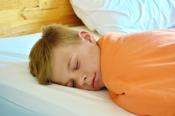 Boy sleeping on bed.  Sweet dream child. - Фото, зображення
