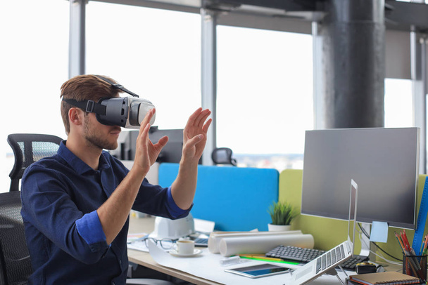 Shot of an engineer wearing a VR headset in an new building. Change the way you see and experience the world. - Foto, imagen