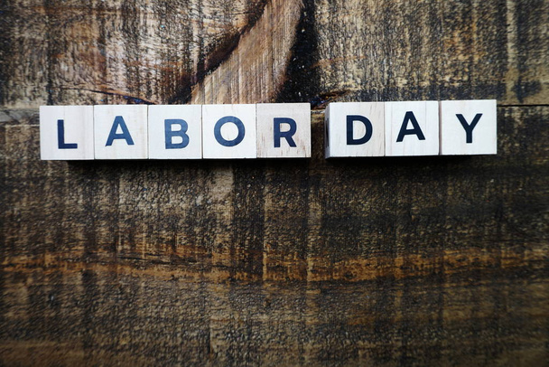 Labor Day alphabet letter with space copy on wooden background - Φωτογραφία, εικόνα