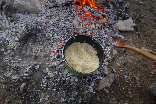 Cookware rice meal, camping area. - Photo, Image