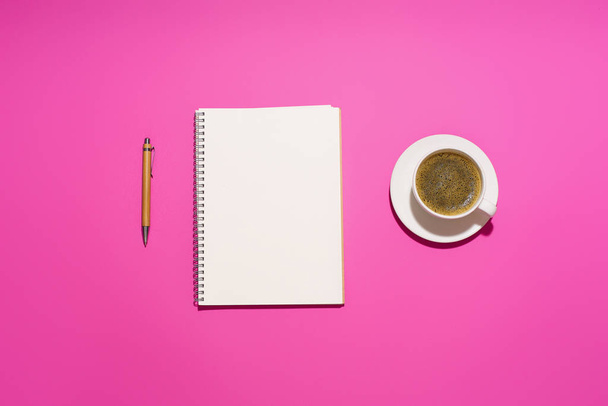 coffee in white cup with blank notepad and pen on purple background, close view  - Foto, imagen