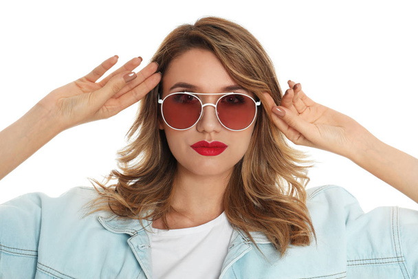 Young woman wearing stylish sunglasses on white background - 写真・画像