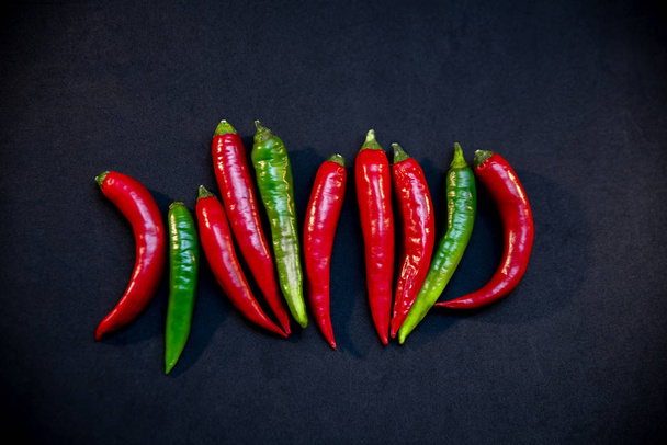 hot peppers on a black background - Photo, image