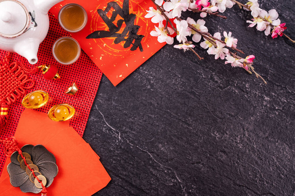 Design concept of Chinese lunar January new year - Festive accessories, red envelopes (ang pow, hong bao), top view, flat lay, overhead above. The word 'chun' means coming spring. - 写真・画像