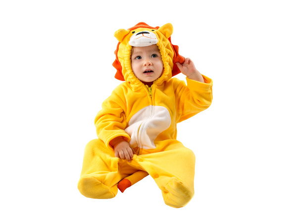 Child girl,dressed in lion carnival suit, isolated on white background. Baby zodiac - sign Leo. The concept of childhood and holiday - Fotografie, Obrázek