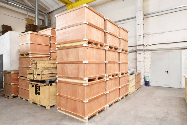 Large and light warehouse, cargo storage with wooden boxes. - Фото, изображение