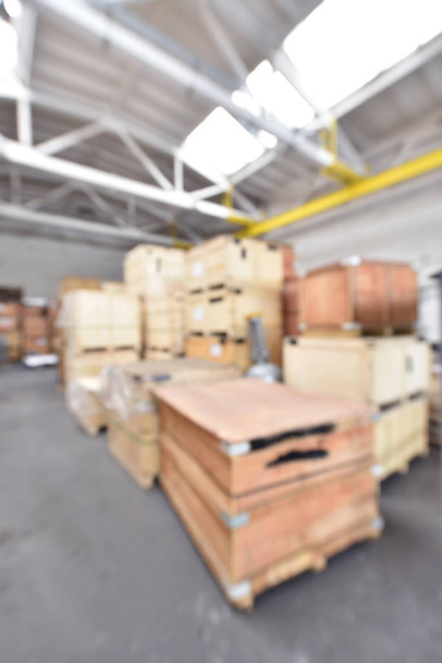 Blurred background in warehouse with wooden boxes. - Photo, Image