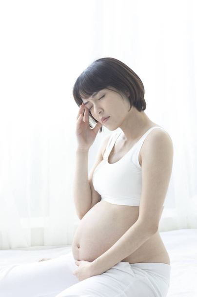 young beautiful Asian pregnant woman - Fotó, kép