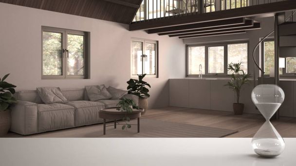 Білий стіл або полиця з кришталевим пісочним годинником, що вимірює час над вітальнею в заміському будинку з диваном і кухнею, архітектурний дизайн інтер'єру, копіювання простору фону
 - Фото, зображення