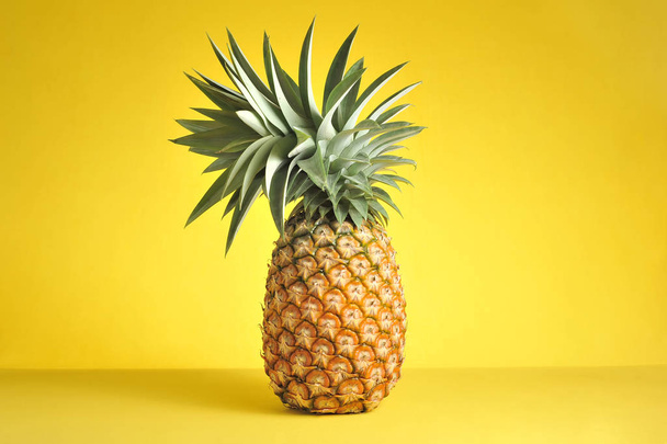 Pineapple on bright yellow background. Fresh pineapple on bright - Foto, Imagen