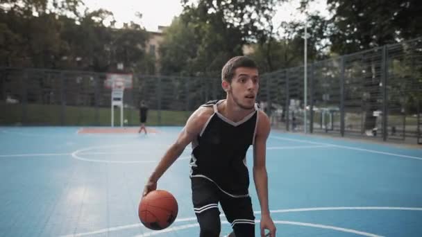 Young Caucasian Jock has Basketball Training. Caucasian Guy Handling a Ball, Throwing and Scoring on the Urban Street Sports Basketball Court. Healthy Lifestyle and Sport Concept. - Πλάνα, βίντεο