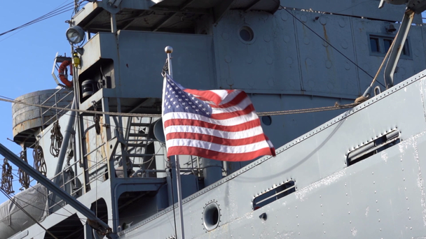 USA flag waving at wind in front of a military ship, slow motion - Footage, Video