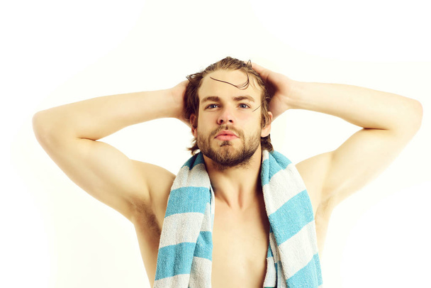 Macho with striped blue towel around neck and big muscles - Foto, immagini