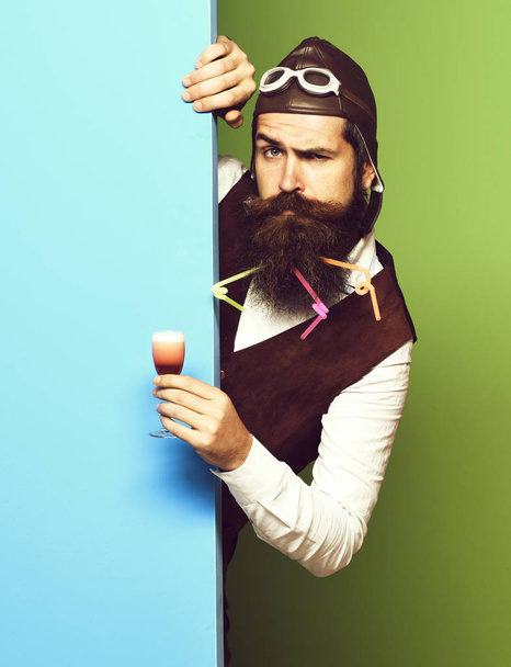 serious handsome bearded pilot or aviator man with long beard - Фото, изображение