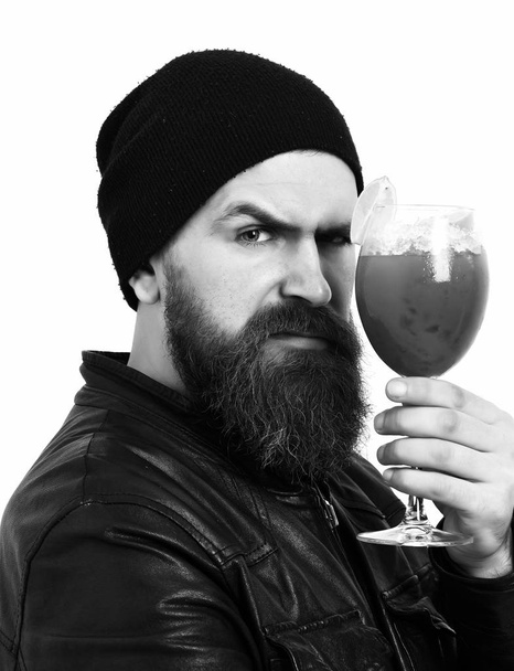 Brutal caucasian hipster holding alcoholic beverage or fresh cocktail - Φωτογραφία, εικόνα