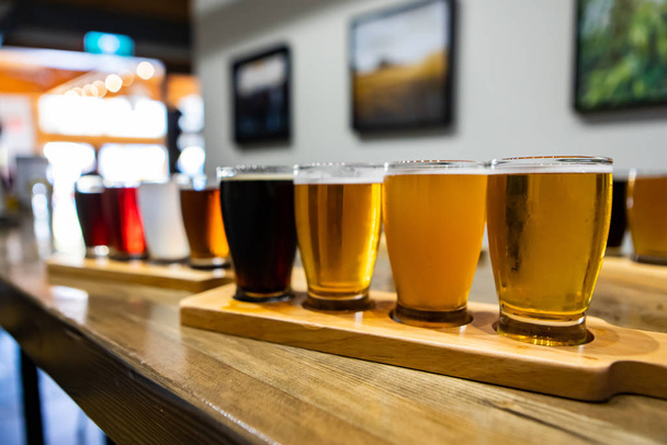 Flight craft beer glasses on wooden tray - Photo, Image