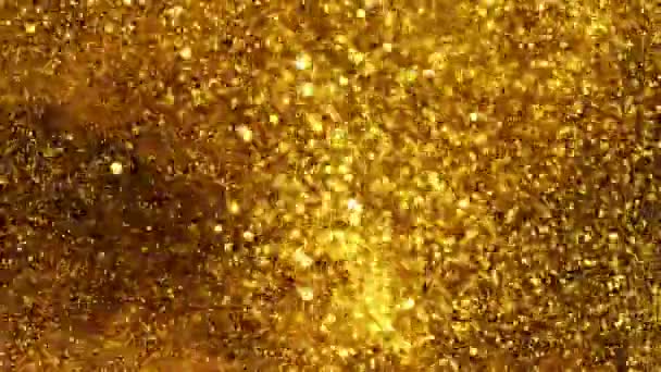 Super langzame beweging van glinsterende gouden deeltjes op zwarte achtergrond. Ondiepe scherptediepte. Gefilmd op hoge snelheid bioscoop camera, 1000 fps. - Video