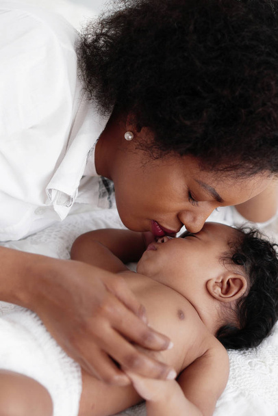 portrait of sleeping african american baby girl with mother - Photo, Image