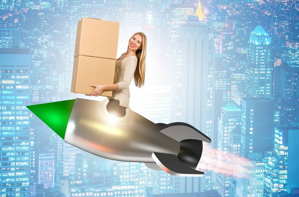 Woman in fast box delivery service on rocket - Photo, Image