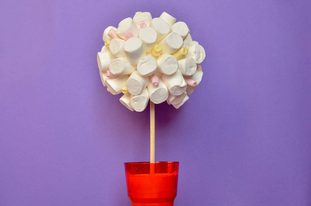 Tree made of marshmallows on colorful background - Photo, Image
