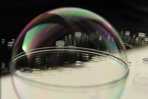 soap bubble on the mirrored surface. - Photo, image