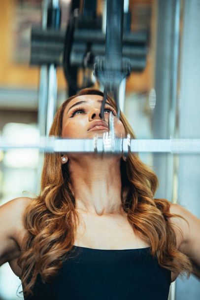 photo of a girl exercising with a weight bar - Photo, Image