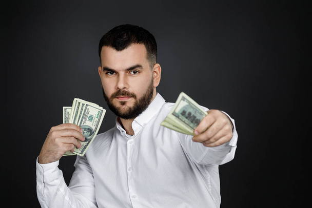 bearded man holding money banknotes - Fotoğraf, Görsel