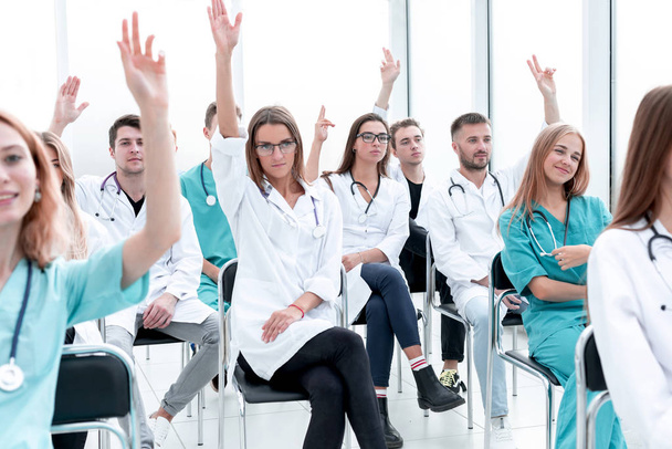 group of young doctors ask important questions. - 写真・画像