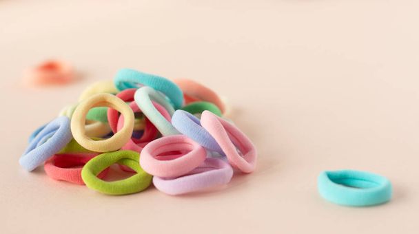 Many different colors of scrunchy on the soft beige background - Photo, Image
