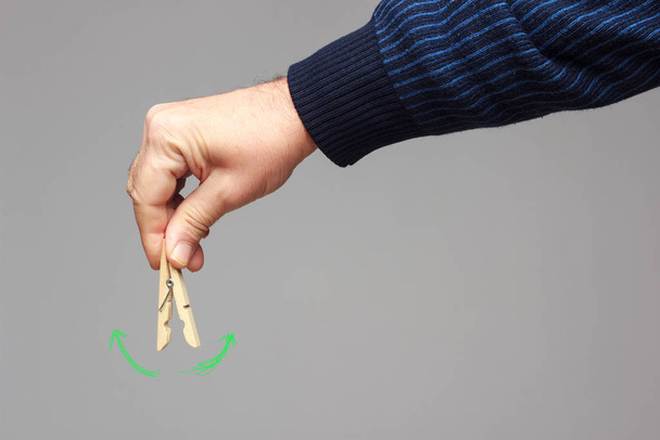 Clothespin in the hand of an adult - Photo, Image