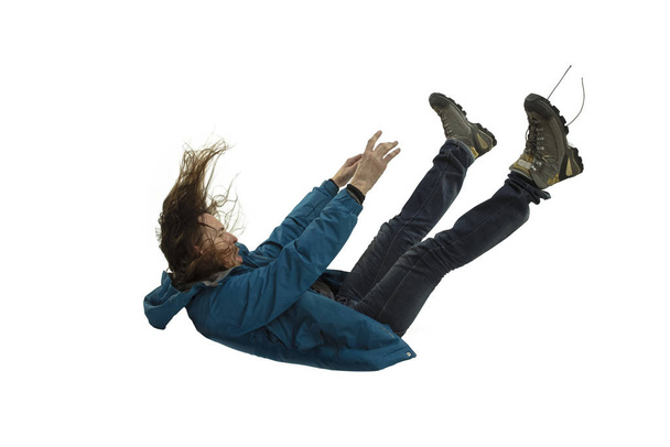 A second before falling - young man falling down with bright emotions and expression - Photo, Image