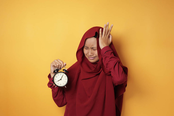 Young Teenage Asian Muslim Girl Worried by Time - Photo, image