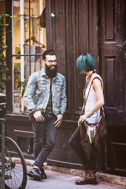 Young hipster couple chatting - 写真・画像