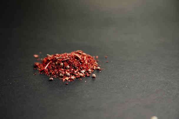 Cloves, garlic and pepper for seasoning. Spices on a black background.  - 写真・画像