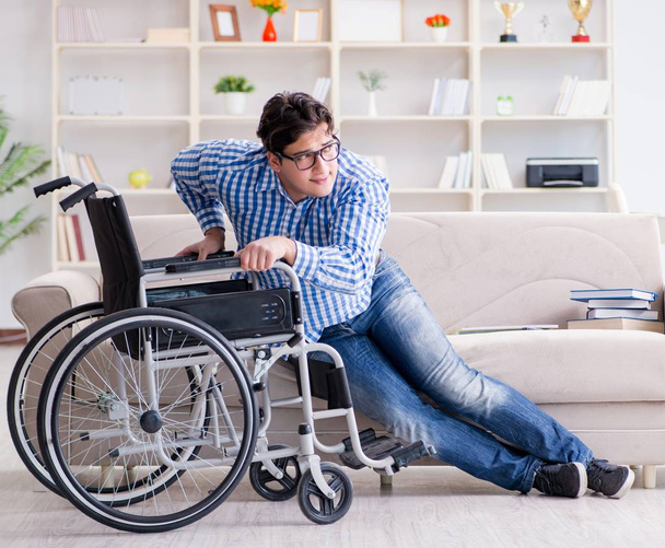 Young student on wheelchair in disability concept - Photo, Image