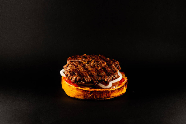 burger hamburger isolated at the black background - Фото, зображення