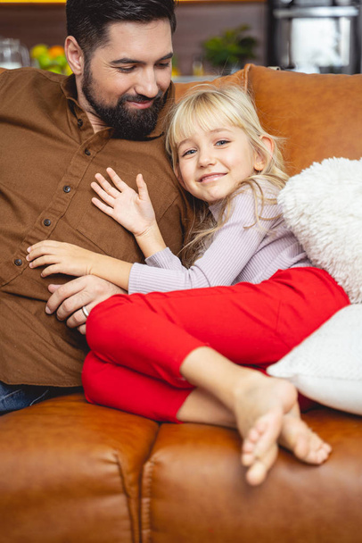 Adorable little girl spending time with father at home - Fotoğraf, Görsel
