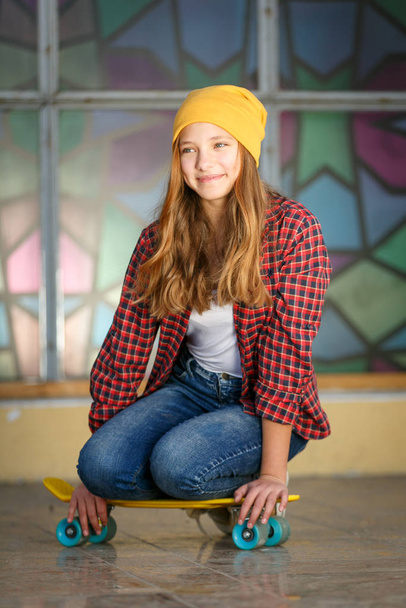 Lifestyle vertical outdoor portrait of young smiling teenage gir - Photo, Image
