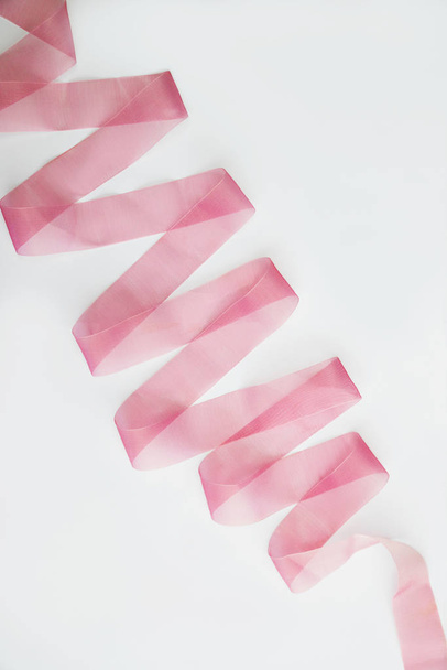 twisted, folded pink transparent tape on a white background. Design element - Zdjęcie, obraz