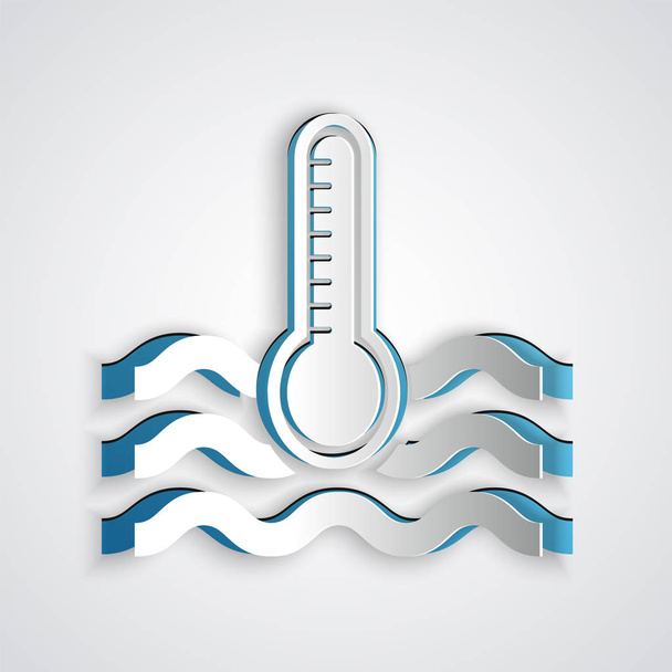 紙カット灰色の背景に隔離された熱と冷たいアイコンを測定する水温度計。高温または低温を示す温度計機器。紙のアートスタイル。ベクターイラスト - ベクター画像